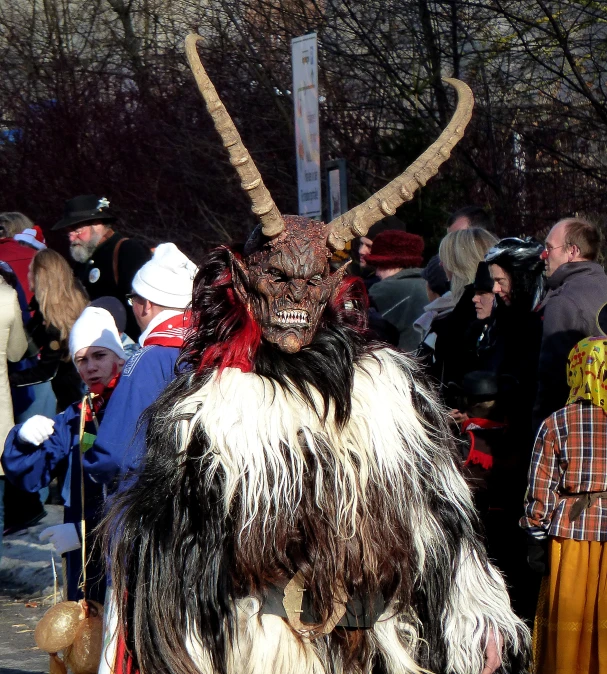 a couple of people with a costume standing in a street