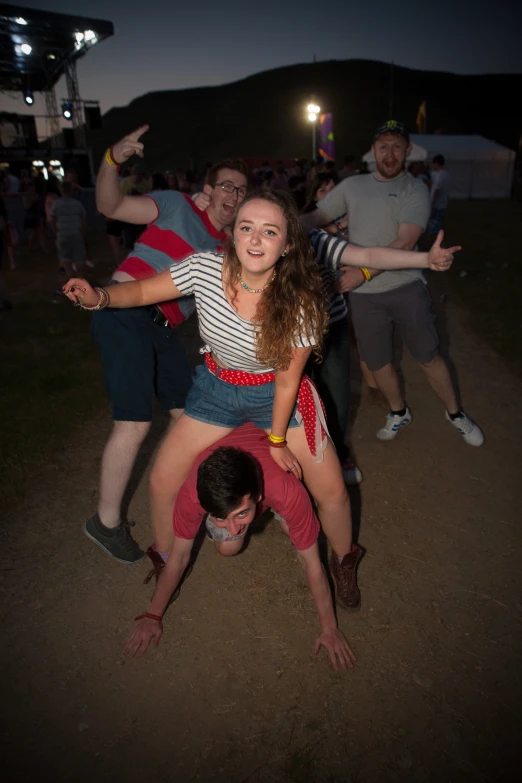 a group of people that are standing up in the dirt