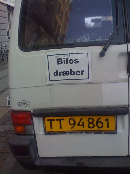 a white van with a yellow tag on the door