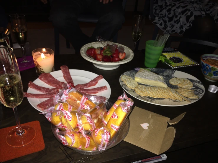 plates of food on a table with a candle