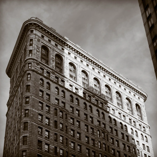 a tall brick building that is next to a tall building