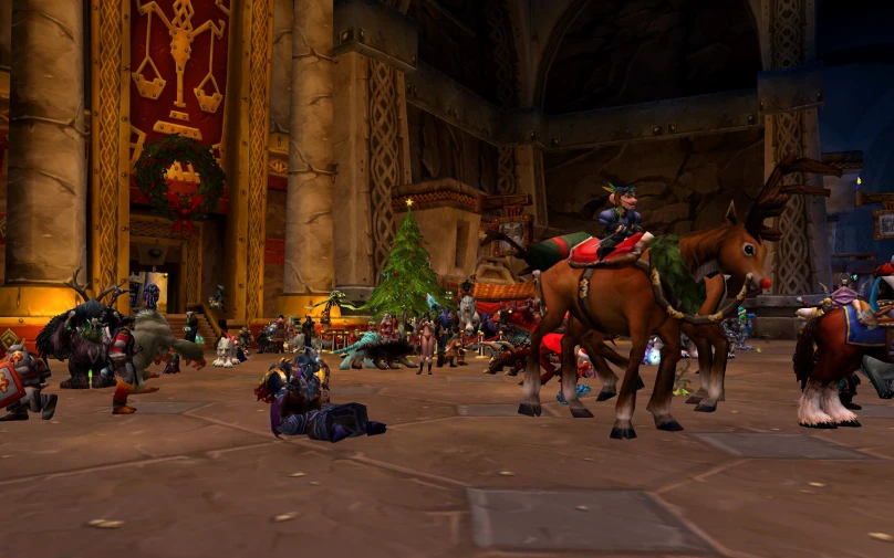 a group of people and horses are in a big building