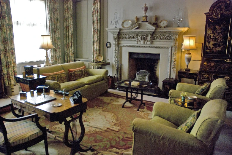 a formal sitting room in a house with beige and green furniture