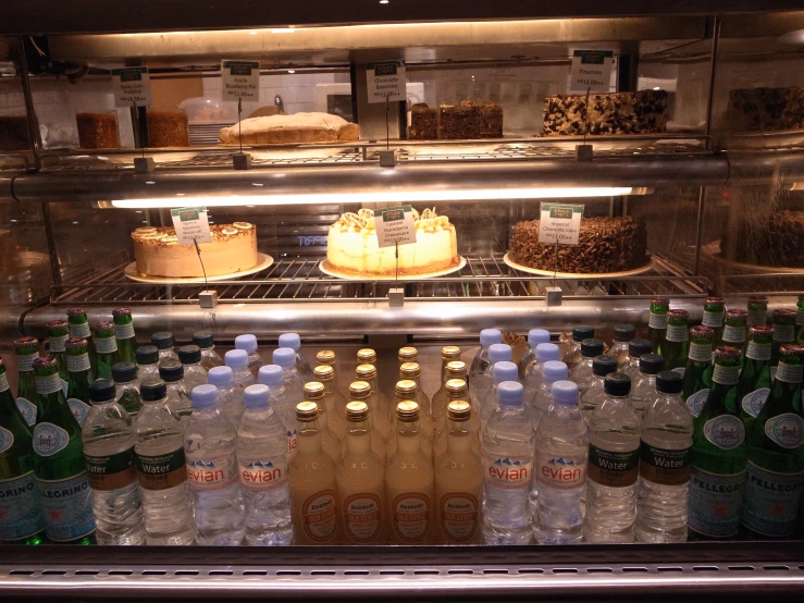 a cold display of various cake and beverages