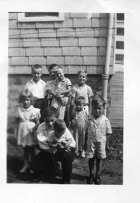 black and white pograph of several children posing