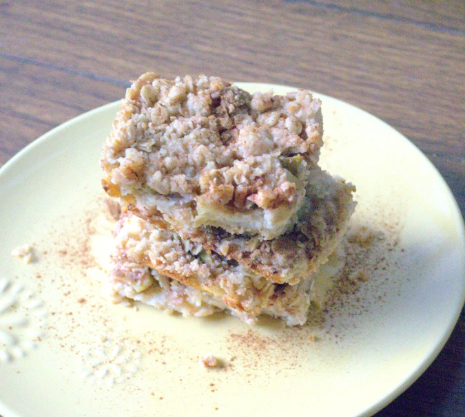 two pieces of dessert sitting on top of a plate