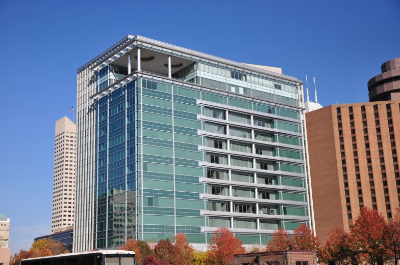 an office building in front of tall buildings