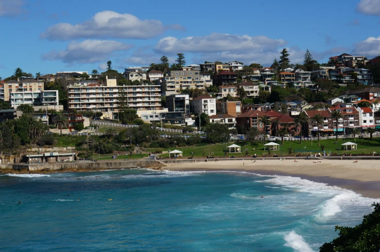 an image of a beach with many buildings in the background