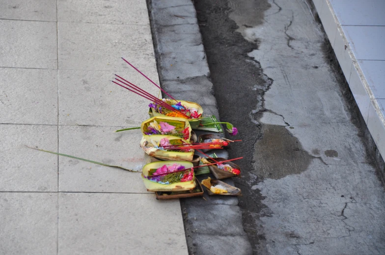 a couple of buns stacked next to each other on the sidewalk