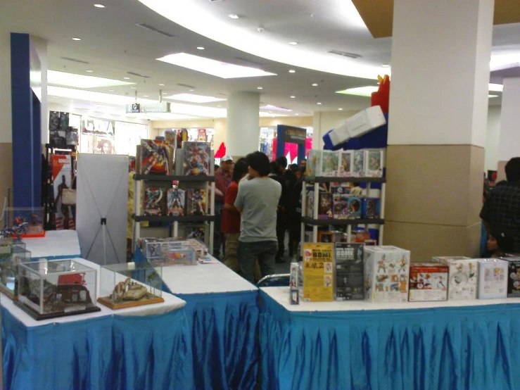 people are browsing for the various items on display