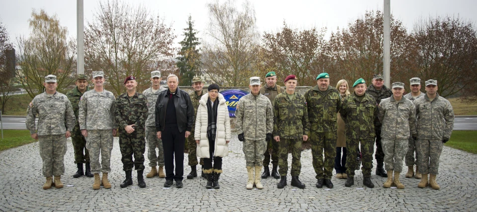 a group of people dressed in military camouflage standing together