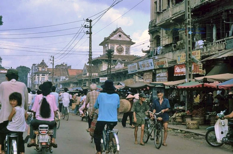 an urban street scene with pedestrians and bicycles