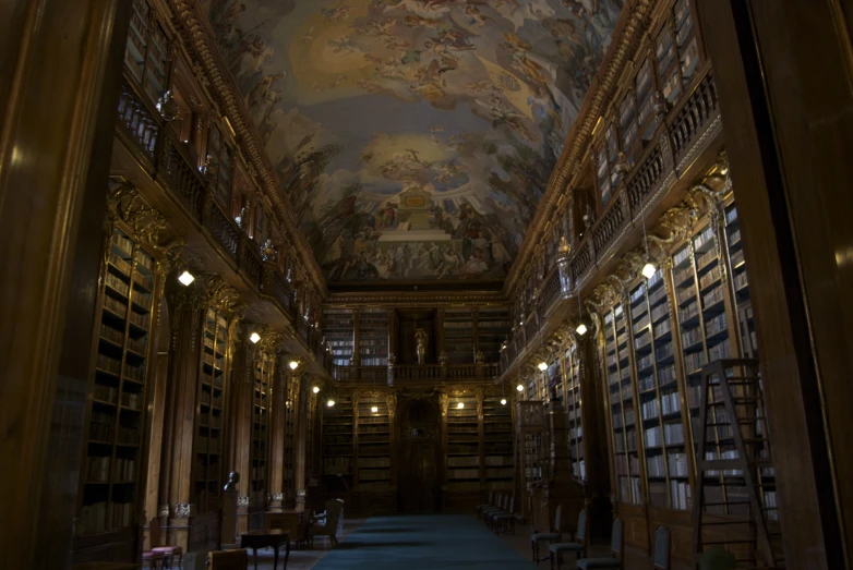 a room with many bookshelves full of books