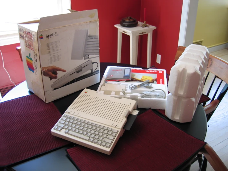 there is a boxed up white computer sitting on the table