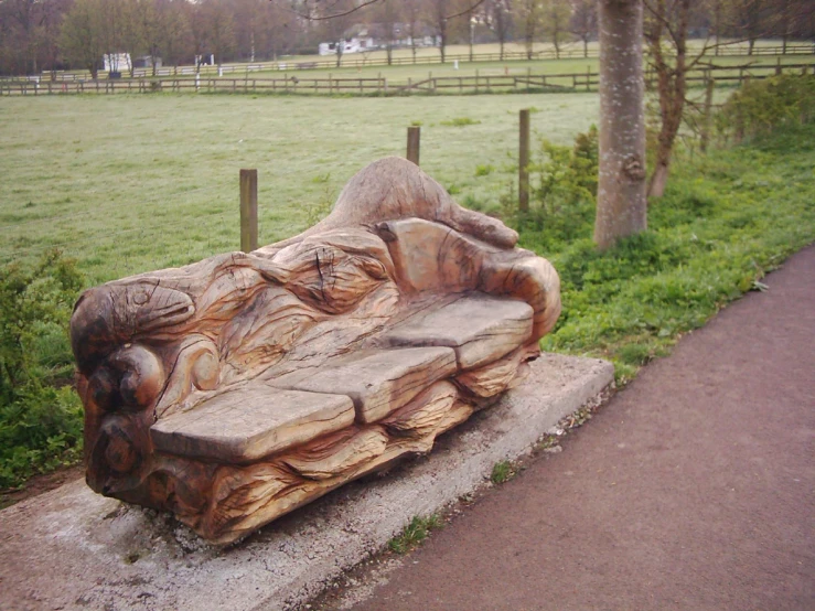 a wooden bench that looks like someones garden couch