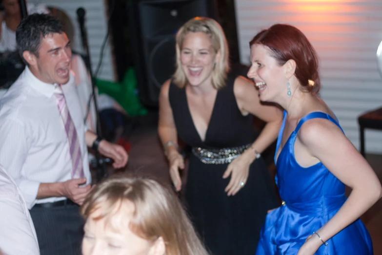 a group of people laughing together at a party