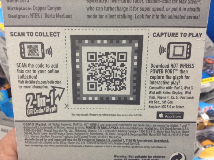 a hand holding a piece of paper with a qr - code on it