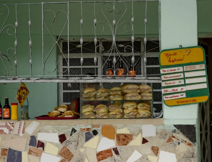 baked goods are displayed on a stand outside