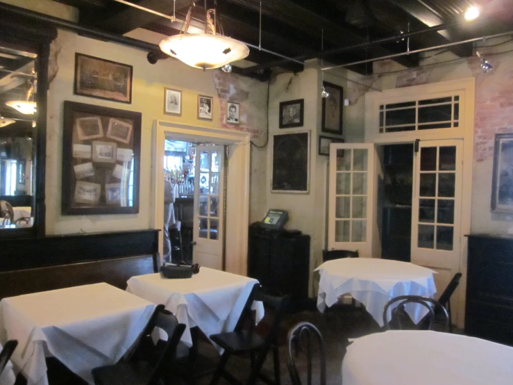 the dining area at an establishment with round tables