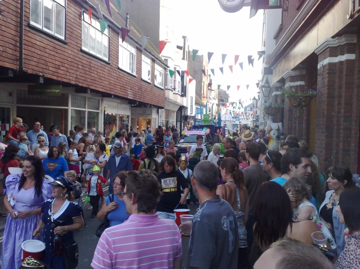 this is an image of a crowd of people in a street