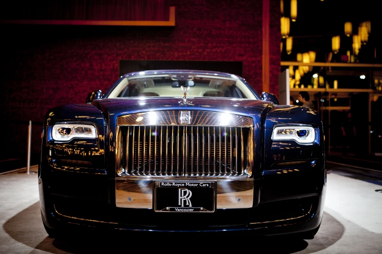 a large, luxurious car sits in the dark