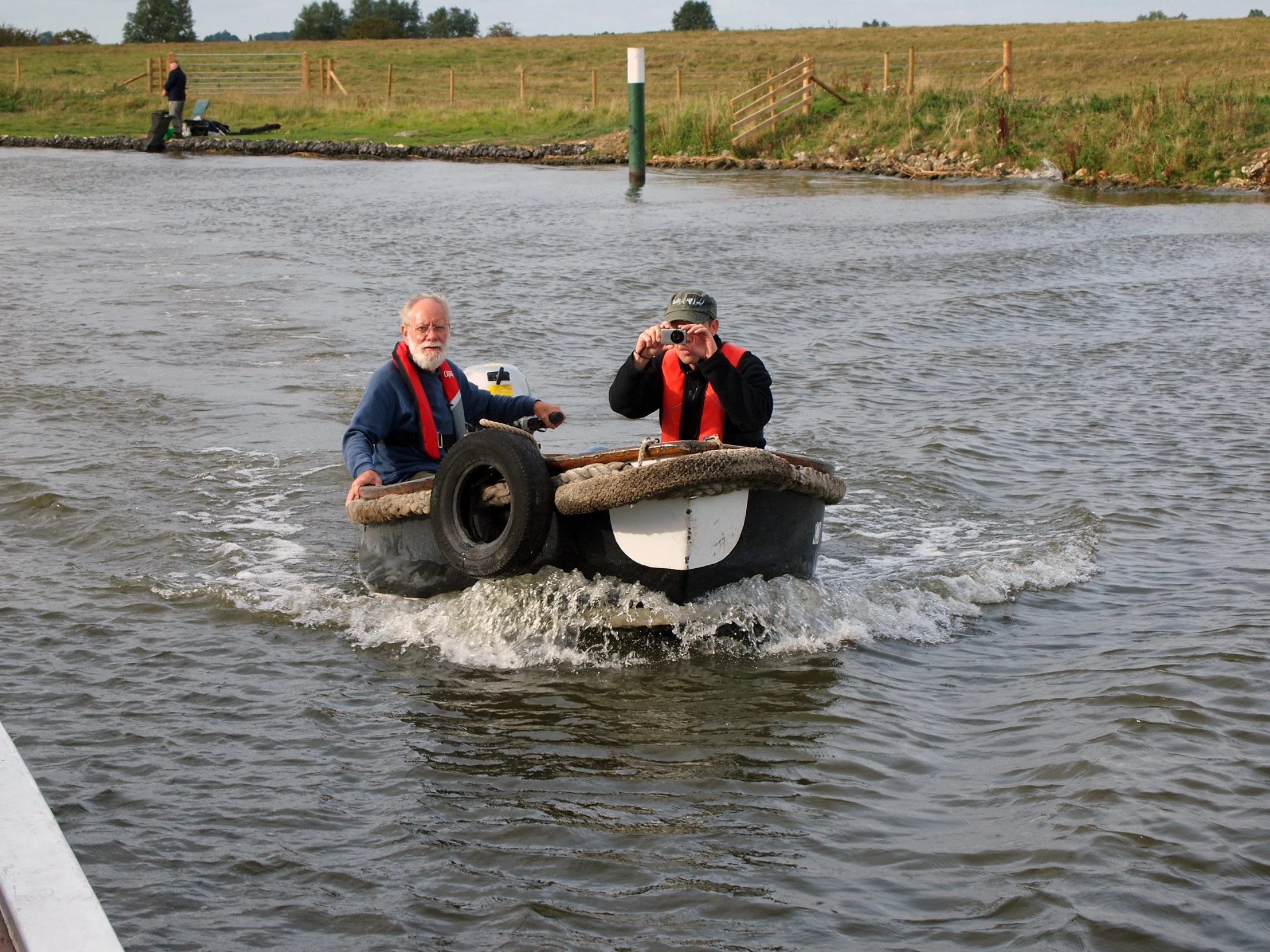 two people riding on a boat in the water