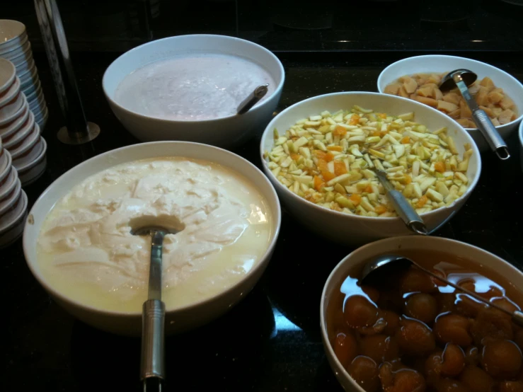 an assortment of various types of food in bowls