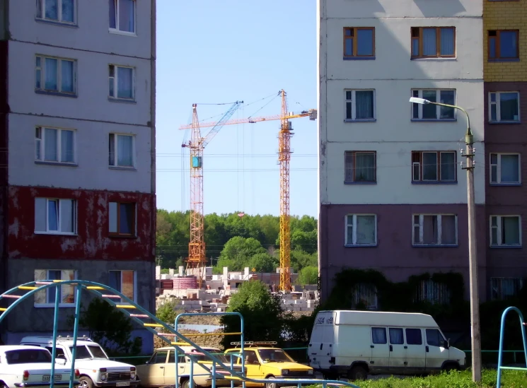 a busy city street with lots of vehicles and construction