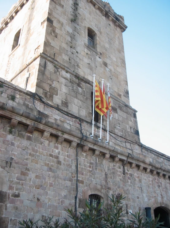 the large flag is hanging from the tower