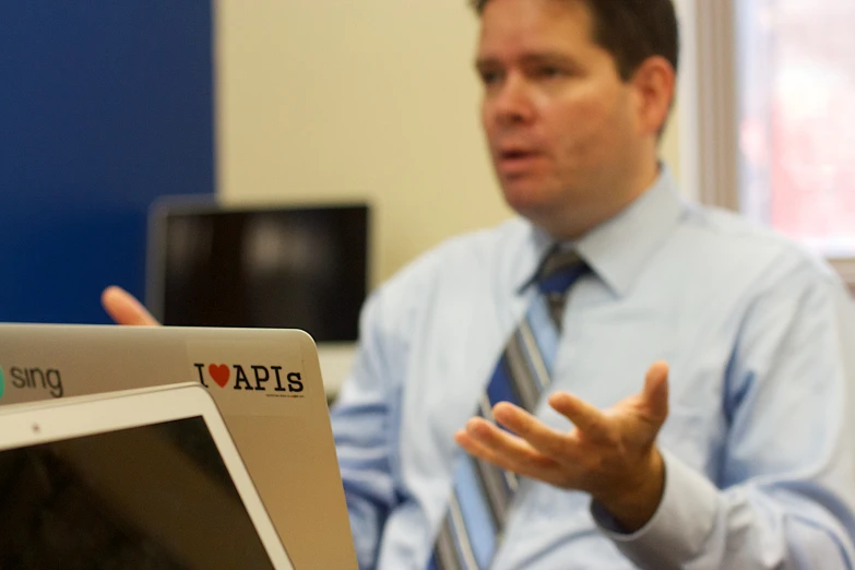 a man is giving a presentation to others