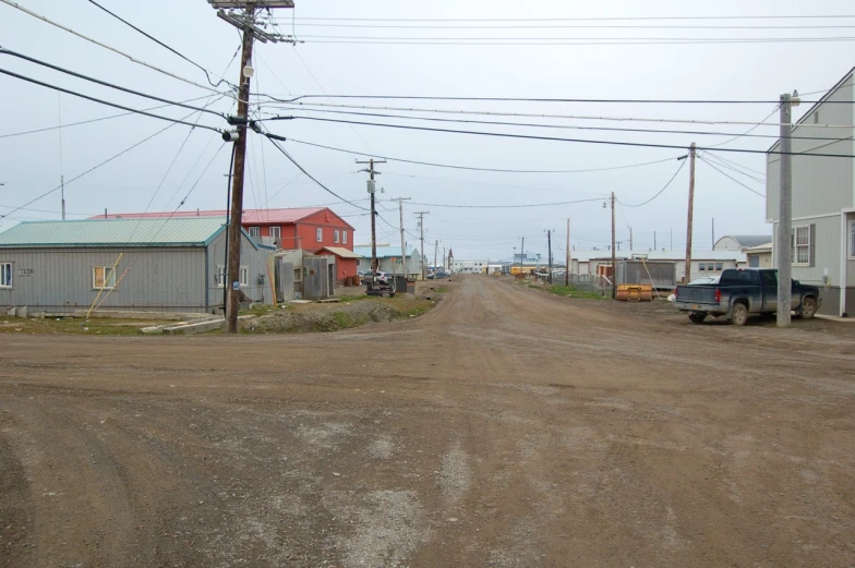 a truck is parked next to a dirt road