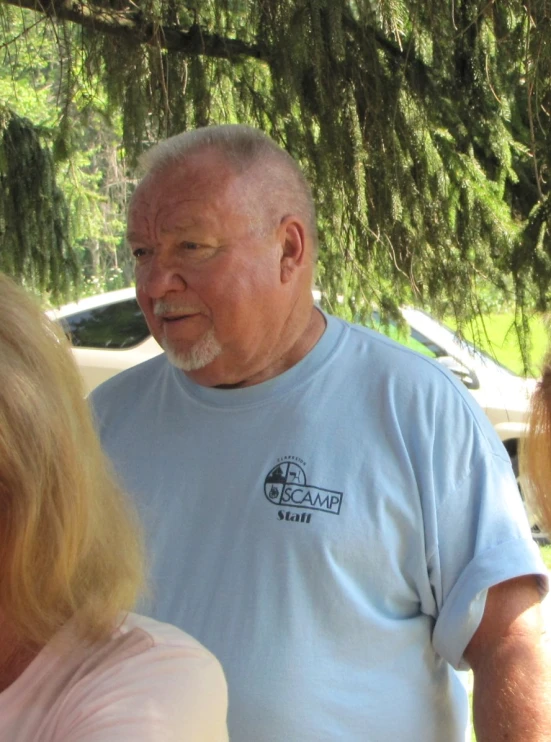 an elderly couple looking away from the camera