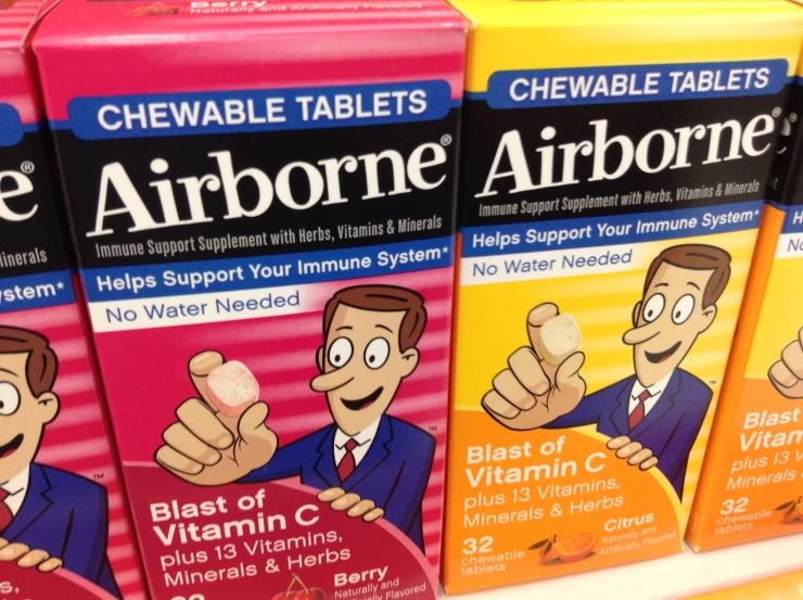 four packs of airborne tablets are being displayed