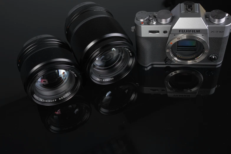 three different types of camera equipment sitting on top of a table