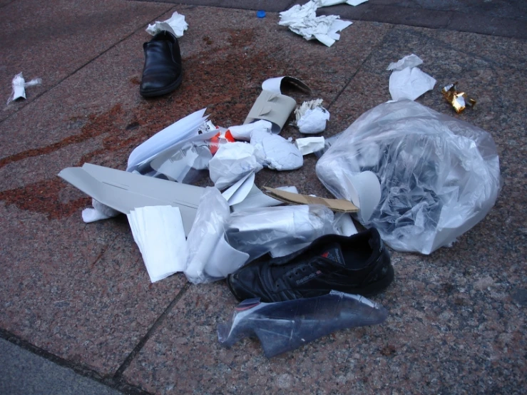 some shoes and items sitting on the ground