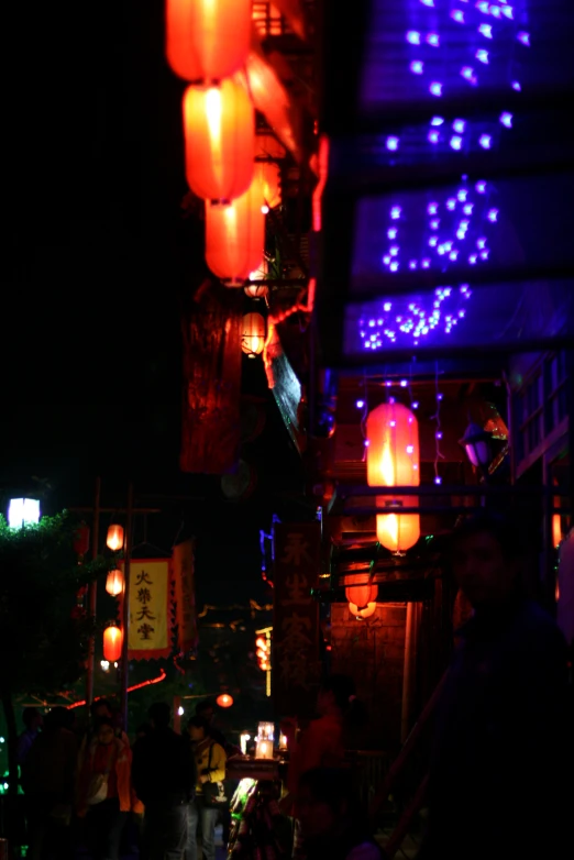 a long row of bright lanterns are lit up