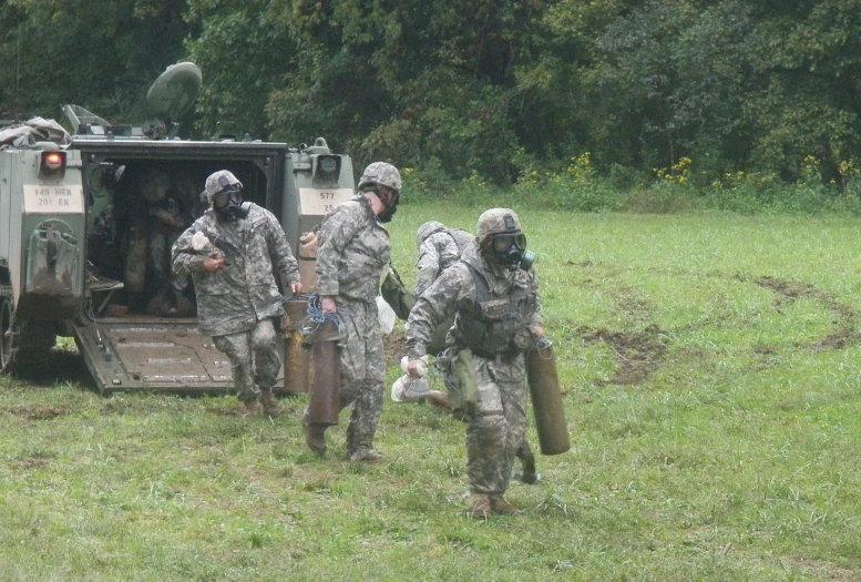 soldiers walking away from a military vehicle