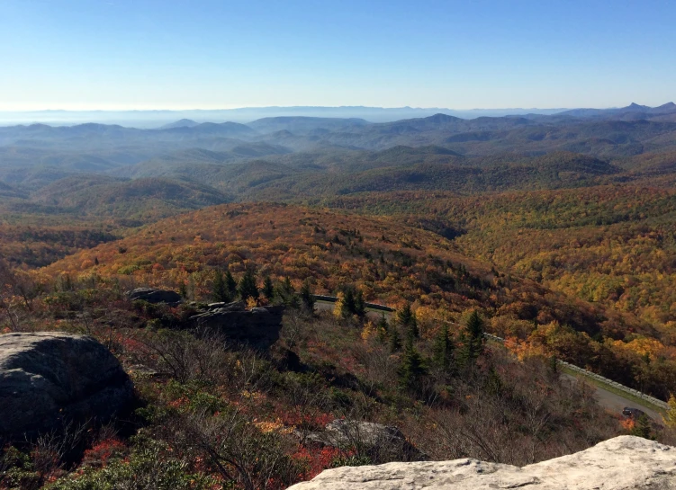 there are many mountains that are covered in fall foliage