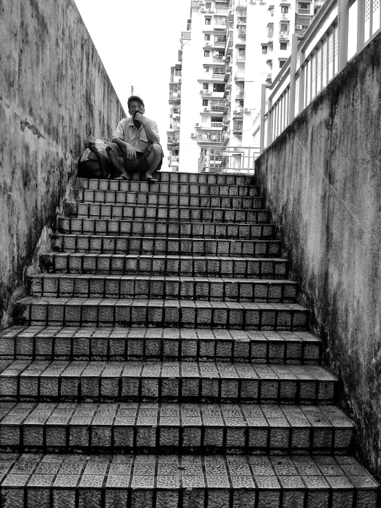 the steps lead up to a man sitting on top