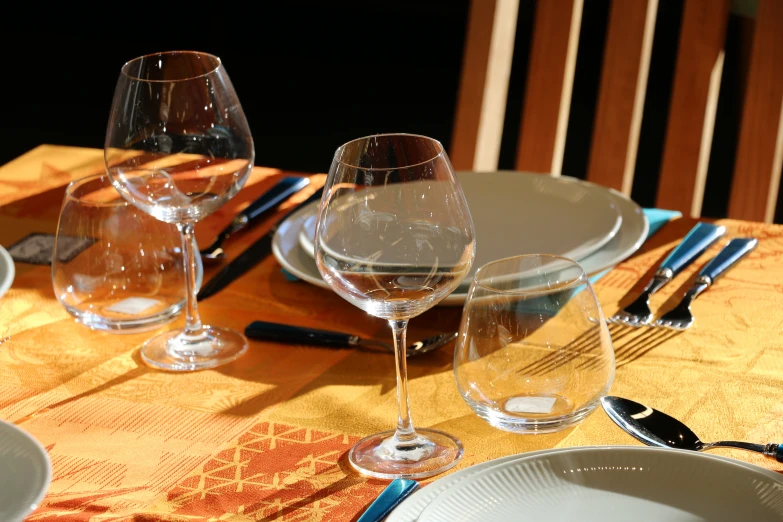 empty wine glasses on a place setting on the table