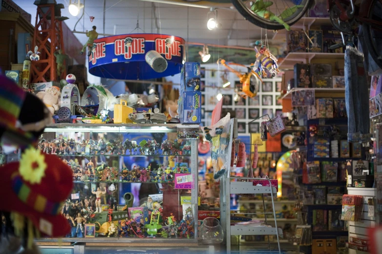 the inside of a toys and stuff store with stuffed animals and other memorabilia