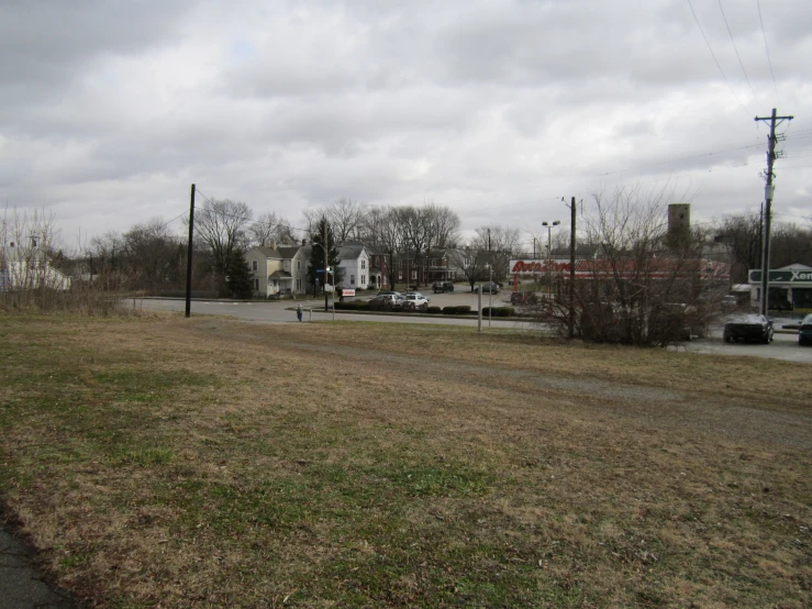 an empty road with lots of traffic and power lines