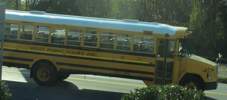 the school bus is parked by the street