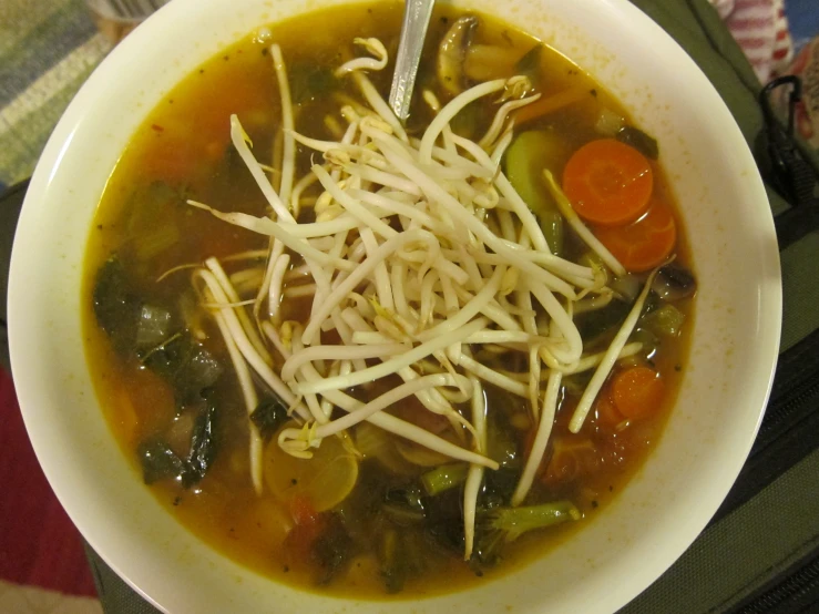 a bowl filled with cheese and vegetable soup