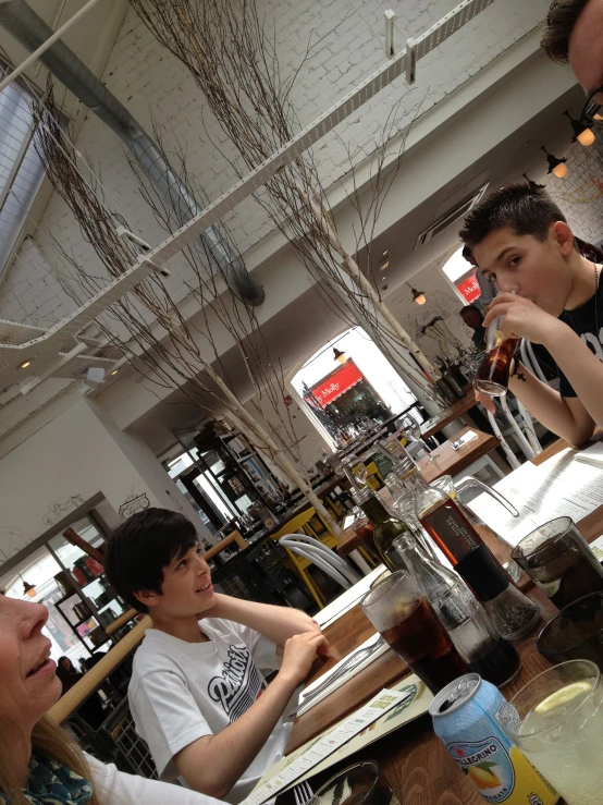 a group of people sitting at a table in a restaurant