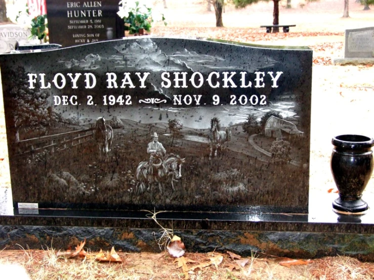 the headstone of floyd ray shockley is next to his grave