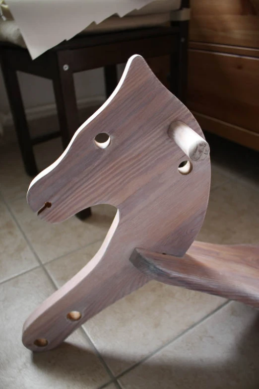 wooden horse head mounted on a shelf of a room