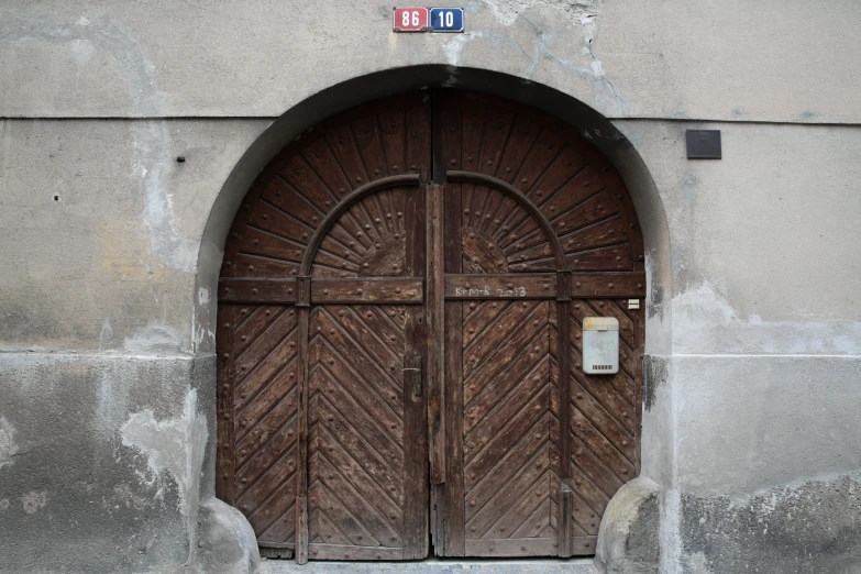 a wood door in a building with three doors