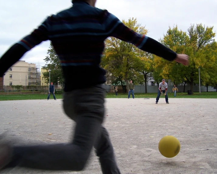 the blurry image shows a man chasing a ball