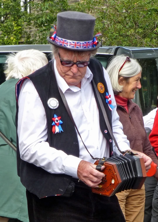 an old man holding a case and looking at soing